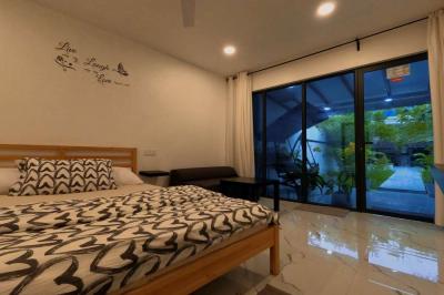 Cozy bed with good garden view from bedroom.