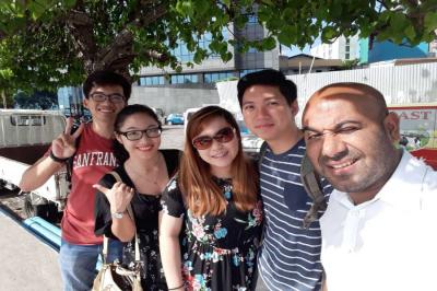 Ismail saying good-bye to guests at the airport